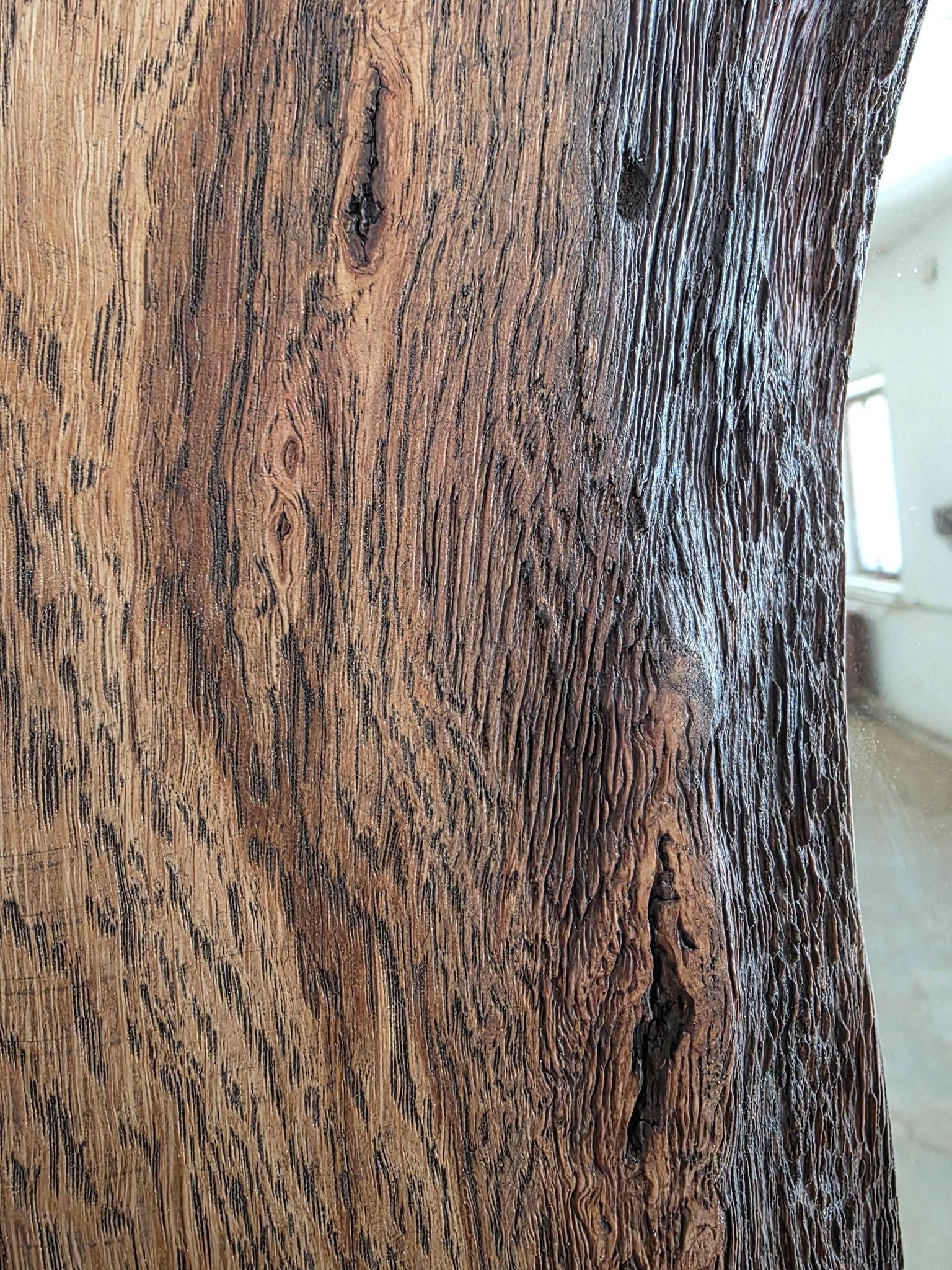 Close-up of a wooden surface with visible grain and texture