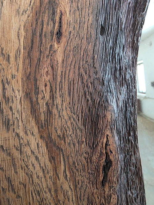Close-up of a wooden surface with visible grain and texture